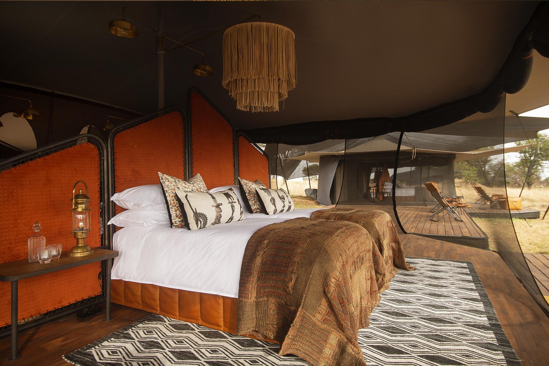 Interior of the luxury tents of the Siringit Migration Camp Our inter-connected family tent can accommodate up to 4 guests (2 adults & 2 children). All canvas tents have en-suite bathrooms with double vanity, hot water on demand, and eco-friendly flush toilets.